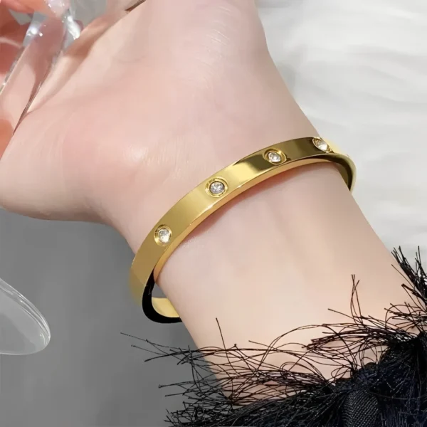 Trendy gold bangle bracelet on wrist – unisex fashion