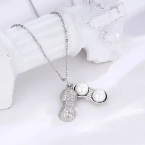 Silver necklace with a peanut-shaped pendant featuring twin pearls inside a textured metallic shell design