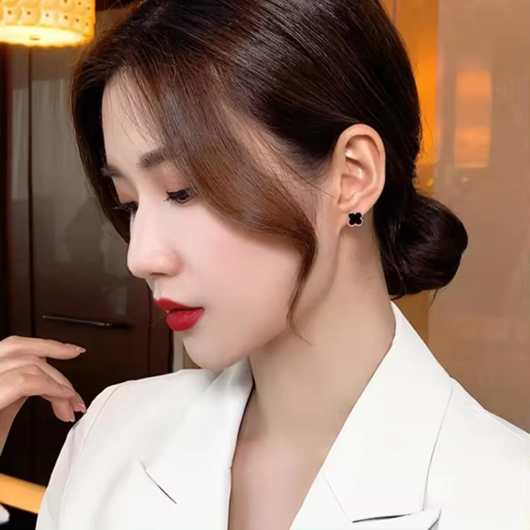 Elegant black clover stud earrings with gold trim – minimal daily wear jewelry for women