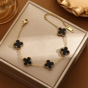 Gold-plated bracelet with black clover charms – trendy daily wear jewelry for women