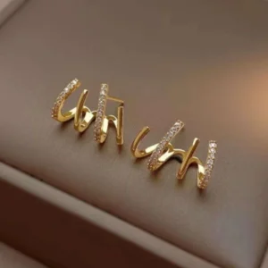 Gold “uh huh” word earrings with crystal detailing – bold trendy statement studs for women
