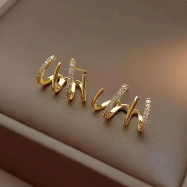 Gold “uh huh” word earrings with crystal detailing – bold trendy statement studs for women