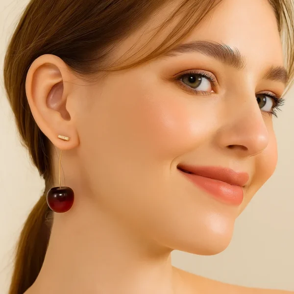 Bold red cherry-shaped drop earrings with gold stems – quirky fruit-inspired jewelry