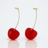 Bold red cherry-shaped drop earrings with gold stems – quirky fruit-inspired jewelry