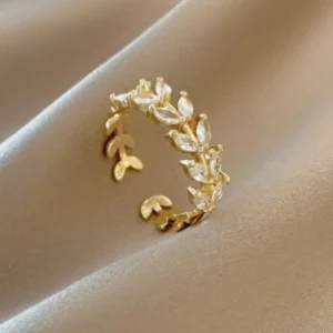 Elegant gold leaf ring with rhinestones, minimal and stylish jewelry for daily wear.
