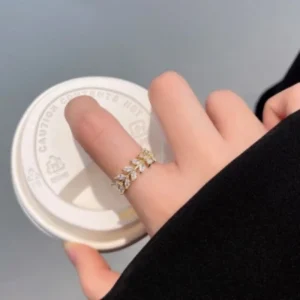 Elegant gold leaf ring with rhinestones, minimal and stylish jewelry for daily wear.
