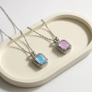 Pastel blue and pink gemstone pendant necklaces with silver chains and crystal borders – dreamy daily wear jewelry.