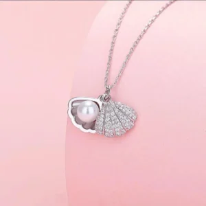 Silver seashell pendant necklace with pearl inside, elegant ocean-themed jewelry for women
