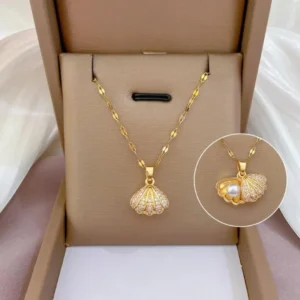 Gold seashell pendant necklace with a hidden pearl inside, ocean-themed elegant neckpiece for women