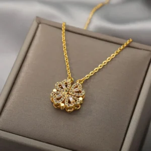 Gold-plated clover-shaped necklace with sparkling white stones and intricate floral heart design