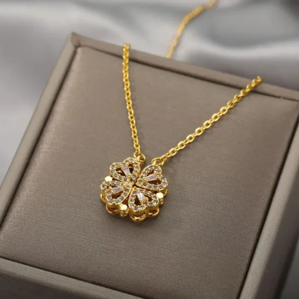 Gold-plated clover-shaped necklace with sparkling white stones and intricate floral heart design