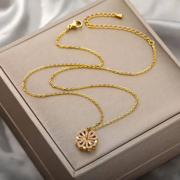 Gold-plated clover-shaped necklace with sparkling white stones and intricate floral heart design