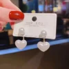 White pearl stud heart drop earrings for girls – cute Korean-style daily wear jewelry.