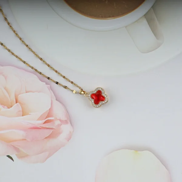 Gold plated red clover pendant necklace with crystal border – elegant, bold everyday jewelry for girls and women.