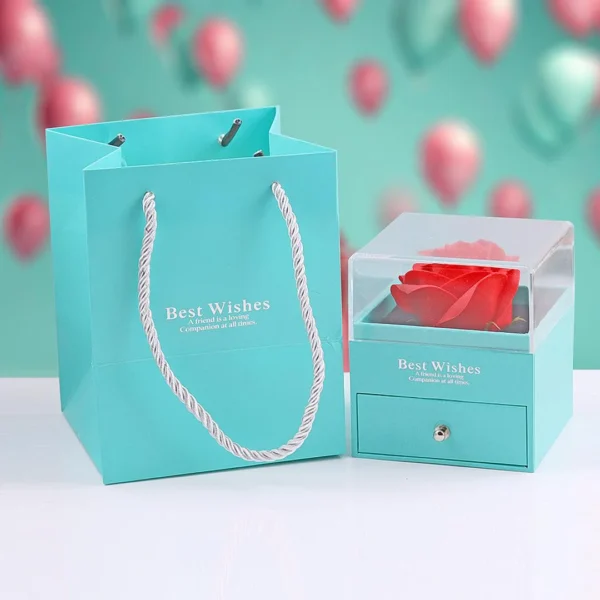 Silver chain heart pendant necklace with pink gemstone and edgy wings – bold y2k-style jewelry.