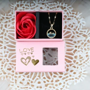 Pink “LOVE” gift box with silver moon and dreamcatcher pendant necklace and one artificial red rose, golden hearts and transparent window.