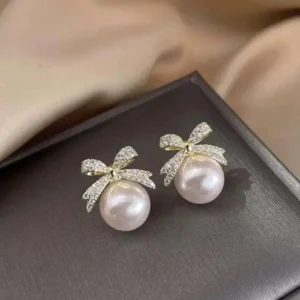 Elegant pearl stud earrings with crystal-studded gold bows – party wear jewelry for women & girls