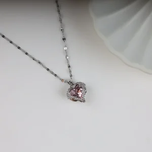 Trendy silver necklace with a light pink heart-shaped crystal pendant, perfect for daily wear.