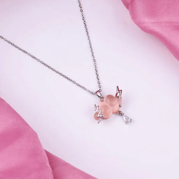 Silver-plated pink cloud pendant necklace with lightning bolts and crystal drop charm.