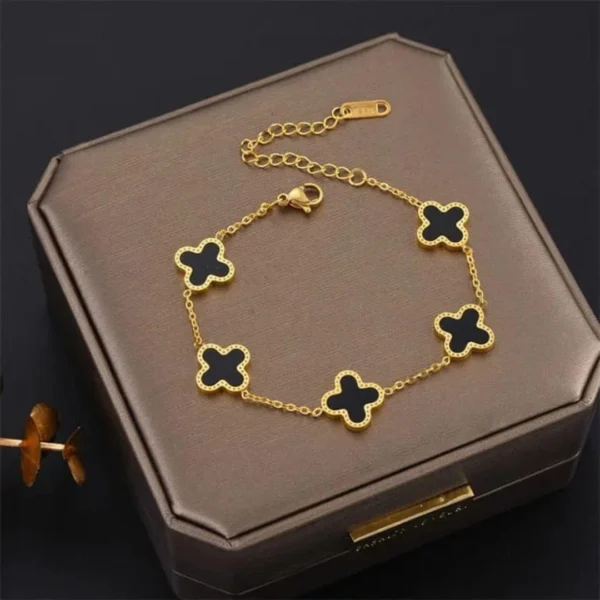 Gold-plated bracelet with black clover charms – trendy daily wear jewelry for women
