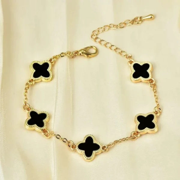 Gold-plated bracelet with black clover charms – trendy daily wear jewelry for women