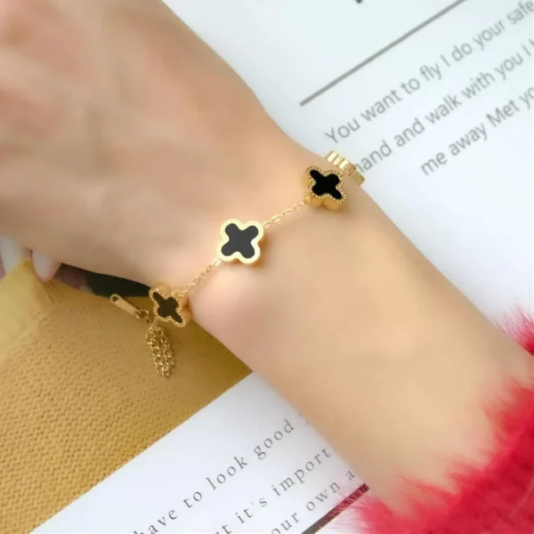 Gold-plated bracelet with black clover charms – trendy daily wear jewelry for women