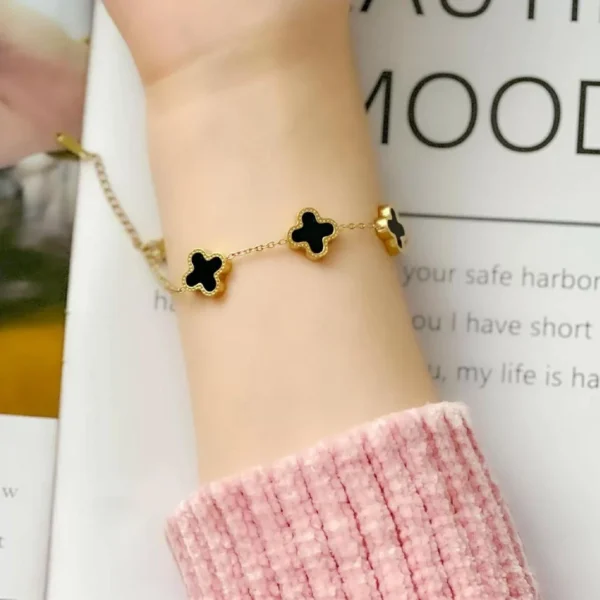 Gold-plated bracelet with black clover charms – trendy daily wear jewelry for women