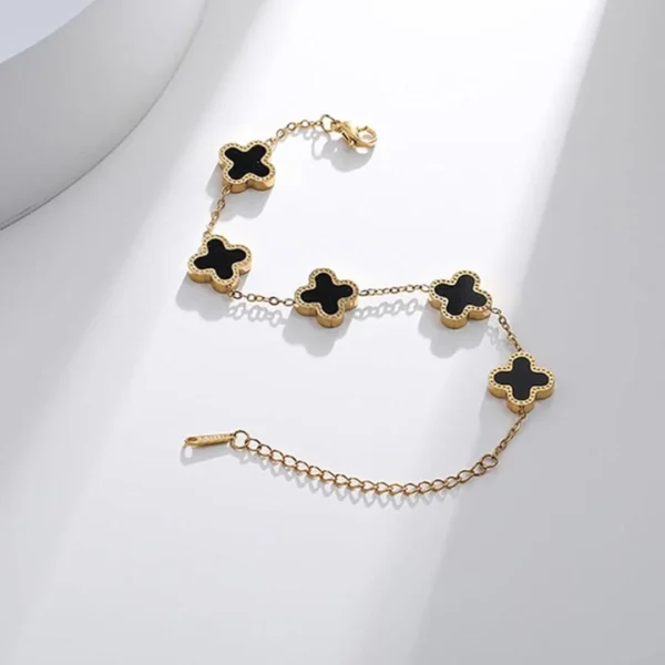 Gold-plated bracelet with black clover charms – trendy daily wear jewelry for women