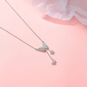 Silver butterfly pendant necklace with white stones and drop charms – elegant daily wear jewelry for girls.
