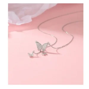 Silver butterfly pendant necklace with white stones and drop charms – elegant daily wear jewelry for girls.