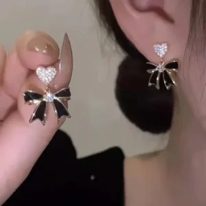 Black bow drop earrings with crystal heart studs, bold and elegant fashion jewelry for women
