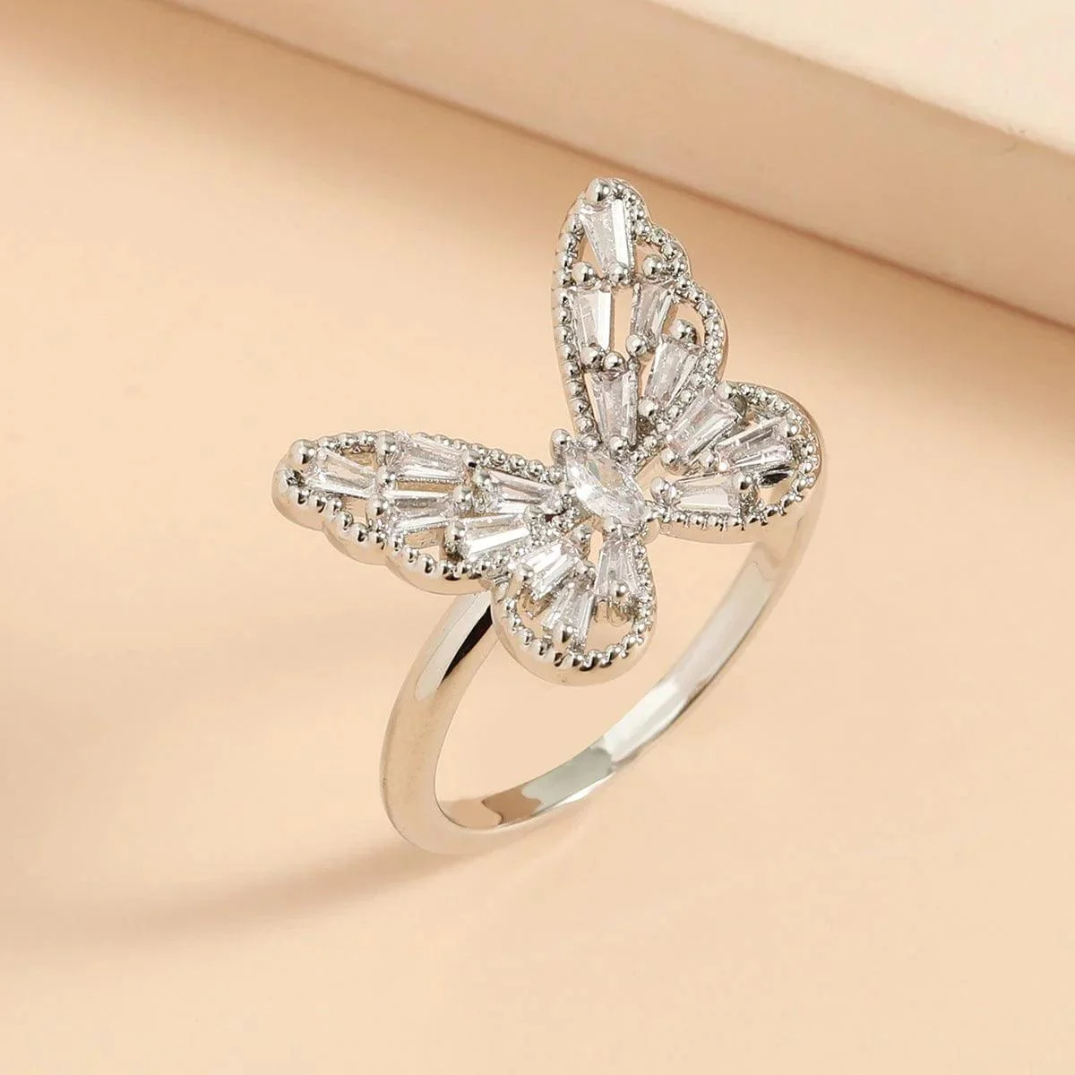 Bold butterfly-shaped silver ring with crystal stones, statement finger ring for women