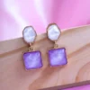 Gold plated purple cube drop earrings with glossy finish