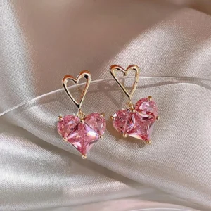 Cute pink heart-shaped drop earrings with gold frame and sparkly crystals for girls